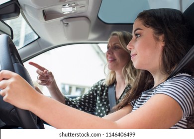 Teenager Having Driving Lesson With Female Instructor
