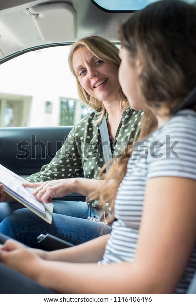 Teenager\
Having Driving Lesson With Female\
Instructor