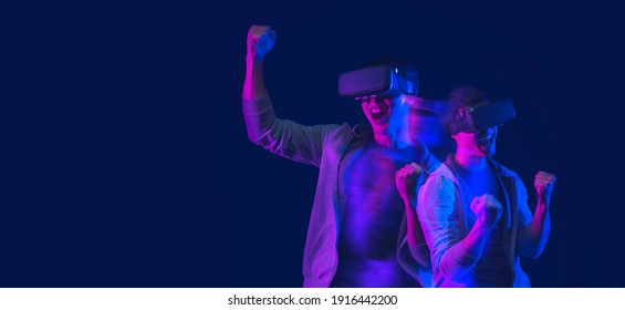 Teenager Having Fun Play VR Virtual Reality Glasses Sport Game Futuristic Neon Colorful Background, Future Digital Technology Game And Entertainment