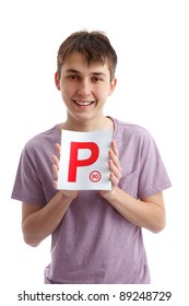 A Teenager Holding A Magnetic P Plate Sign For The Car. Provisional License.   White Background.