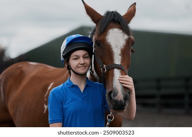 Teenager, horse and portrait outdoor for equestrian, development and learning with bonding or connection. Girl, animal and pet by stable for riding, care and fitness with smile, exercise and helmet - Powered by Shutterstock