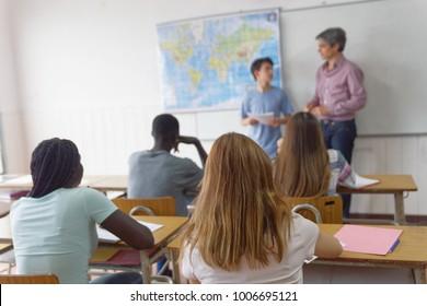 Teenager Interviewed By Teacher In The Classroom.