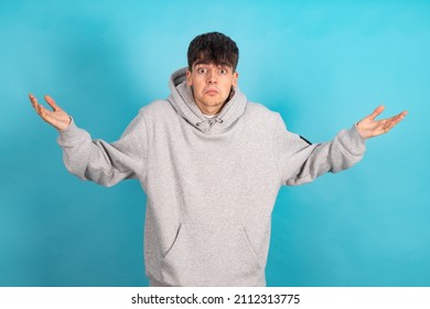 Teenager Isolated On Color Background With Incomprehension Expression