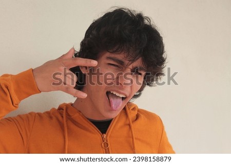 teenager isolated on white with rebellious gesture