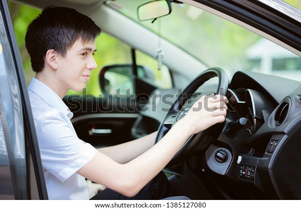 Teenager learns to drive a\
car