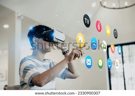 Teenager is opening the internet browser via Virtual reality headset in livingroom, technology and modern lifestyle concept.