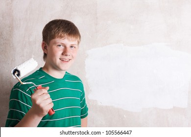 Teenager Painting The Wall