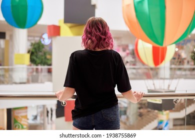 Teenager With Pink Hair In Shopping Mall No People Around