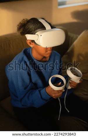 teenager playing virtual reality game