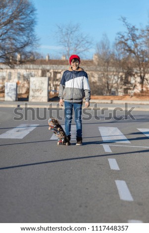 teenager practicing with skateboard at sunrise city