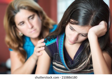Teenager problems - Mother comforts her troubled teenage daughter