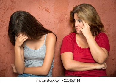 Teenager Problems - Sad Crying Teenage Girl And Her Worried Mother