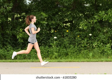 Teenager Running On A Footpath