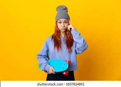 Teenager Russian Skater Girl Isolated On Yellow Background Thinking An Idea