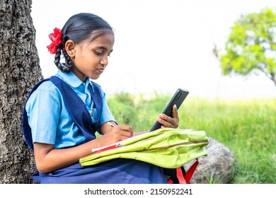 Teenager School Girl Kid Near Agricultural Farmland Listening Online Class - Concept Of Distance Learning, Virtual Assistance And Education.