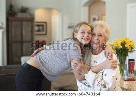 Similar – Woman taking selfie with older mother in wheelchair