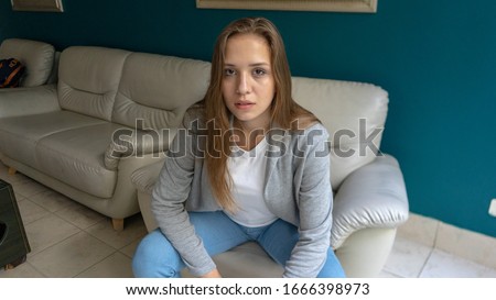 teenager with serious look in hotel
