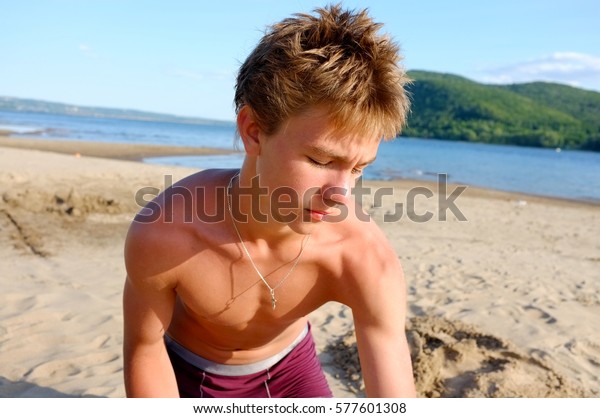 Teenage boy wearing swimming shorts — Stock Photo © Smirno 
