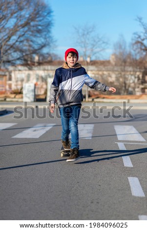 Similar – teenager practicing with skateboard at sunrise city