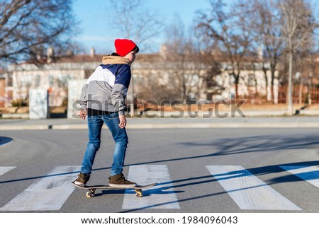 Similar – teenager practicing with skateboard at sunrise city