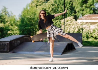 Teenager Skater Girl Holding Skateboard On The Skaters Park