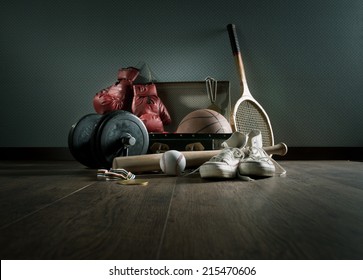 Teenager Sport Equipment In A Vintage Suitcase Including Sports Footwear, Boxing Gloves, Weights And Baseball Bat.