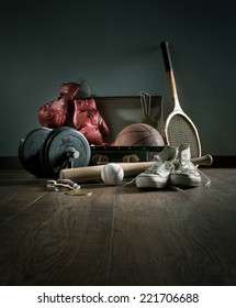 Teenager Sport Equipment In A Vintage Suitcase Including Sports Footwear, Boxing Gloves, Weights And Baseball Bat.