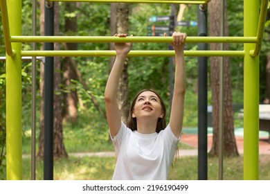 Teenager Sport At School And College, Teen Girl Doing Sports Exercises In A Street Gym