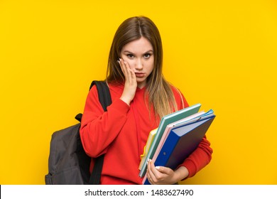 Teenager Student Girl Over Yellow Background Unhappy And Frustrated