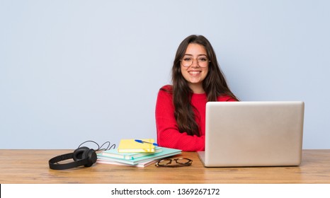 Teenager Student Girl Studying In A Table Keeping The Arms Crossed In Frontal Position