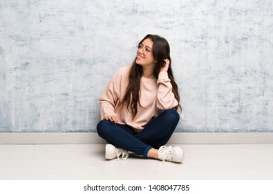 Teenager Student Girl Studying In A Table Thinking An Idea