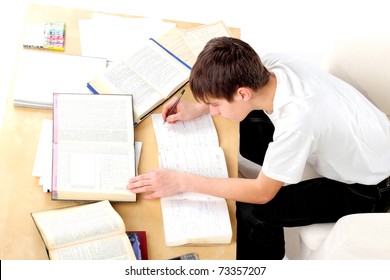 A Teenager Studying Hard For The Exam
