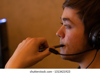 Teenager Vapes While Playing Video Games