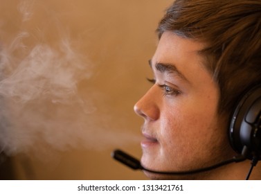 Teenager Vapes While Video Gaming