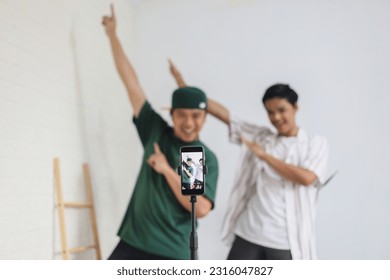 Teenager vlogger boys influencer filming their dances to reel  at home Gen Z doing dance challenge to post on social media