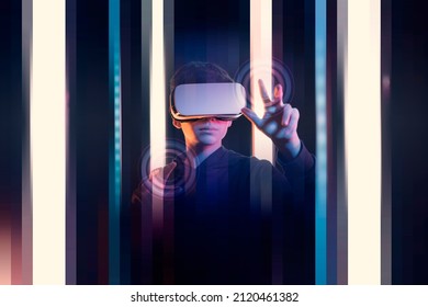 Teenager Wearing A VR Headset And Using A Touch Screen Interface In A Virtual Environment