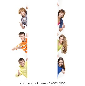 Teenagers with the blank white banner. Perfect space to put any text. - Shutterstock ID 124017814