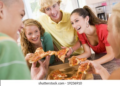 Teenagers Eating Pizza