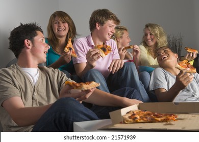 Teenagers Having Fun And Eating Pizza