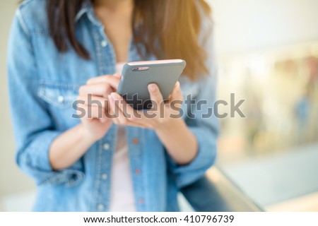 Similar – Image, Stock Photo Detail of hands texting with mobile phones green and blue with computers behind. Messaging apps.