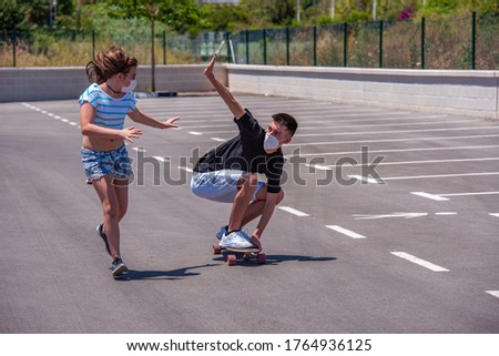 Similar – Happy young woman riding on skate with her friends