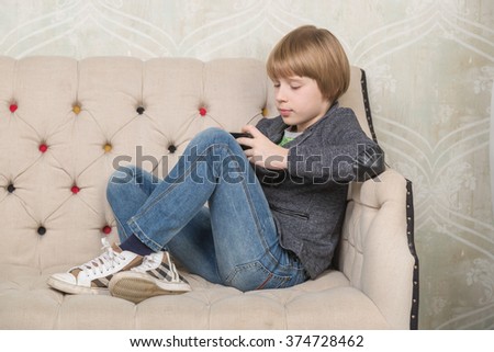 Similar – Little boy using a tablet