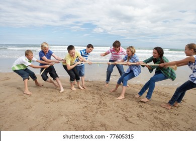 Teenagers playing tug of war - Powered by Shutterstock