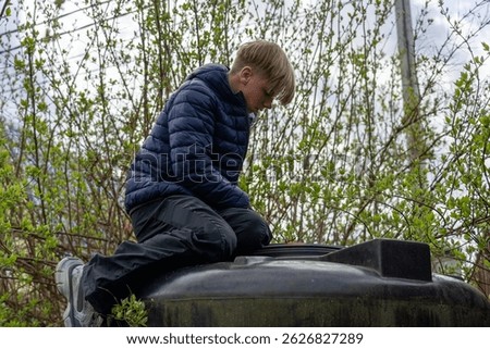 Teenager's Quiet Observation: Contemplative Moment Amidst Spring Blossoms