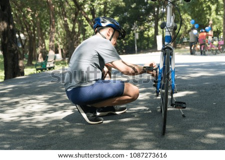 Similar – Image, Stock Photo Two men having fun riding bike and skateboard