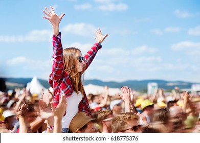 Teenagers at summer music festival enjoying themselves - Powered by Shutterstock