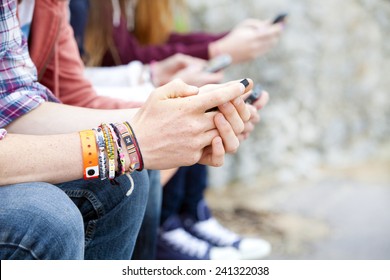 teenagers text messaging - Powered by Shutterstock