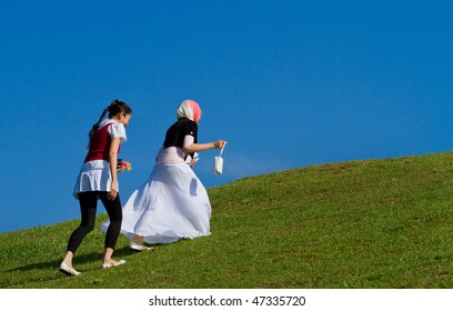 Teenagers walk on the top of the hill
