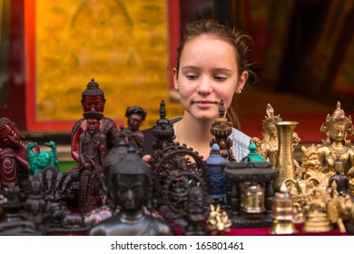 Teen-girl In A Asian Souvenir Shop. 