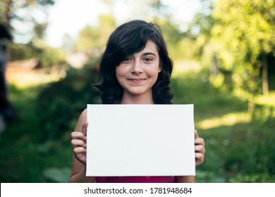 Teengirl Holding Clean White Sheet Paper (banner For Your Message)